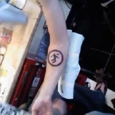 Warning Man Logo Tattoo