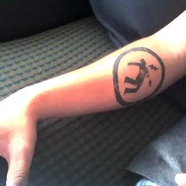 Warning Man Logo Tattoo