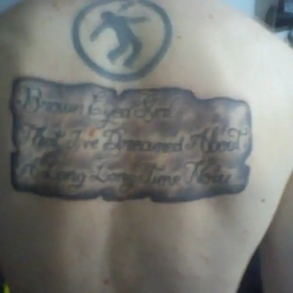 Warning Man Logo Tattoo