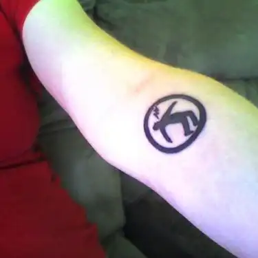 Warning Man Logo Tattoo