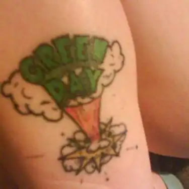 Dookie-Era Bomb Cloud with Green Day Logo Tattoo