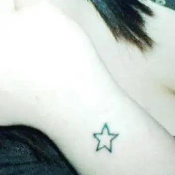 Small Outlined Star Tattoo