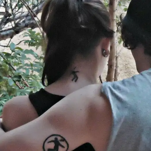 Warning Man Logo Tattoo