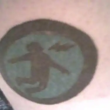 Warning Man Logo Tattoo