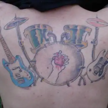 Drum Kit with Hand-Held Heart and Guitars Tattoo