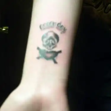Green Day Skull and Crossbones Tattoo