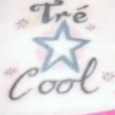 Tré Cool Name and Star Tattoo