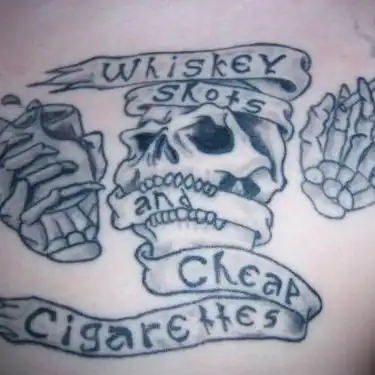 Skull with 'Whiskey Shots Cheap Cigarettes' Banner Tattoo