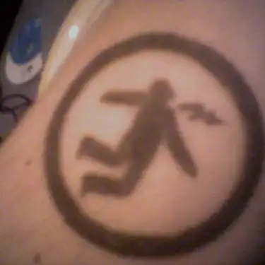 Warning Man Logo Tattoo
