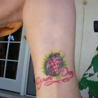 American Idiot Heart Grenade with Green Day Script Tattoo