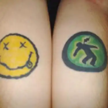 Warning Man Logo Tattoo