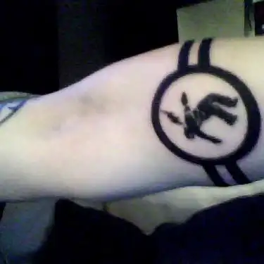 Warning Man Logo Tattoo