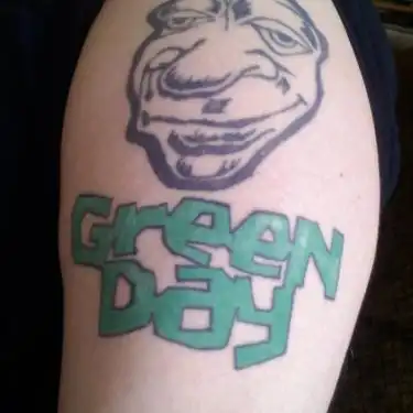 Green Day Logo with Cartoon Face Tattoo