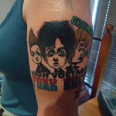 Green Day Logo with Three Cartoon Faces Tattoo