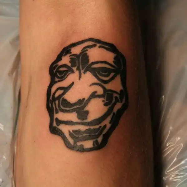 Stylized Face Tattoo
