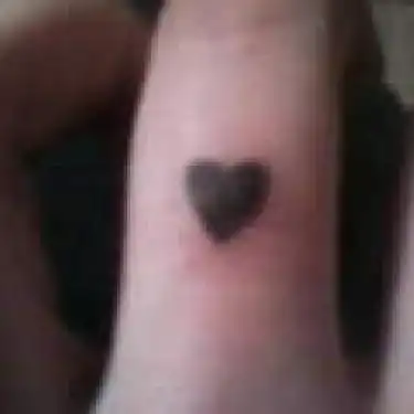 Billie Joe Finger Heart Tattoo
