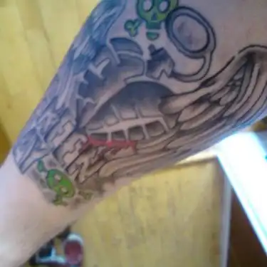 Winged American Idiot Heart Grenade with Green Skulls Tattoo