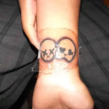 21st Century Breakdown Skull Faces Tattoo