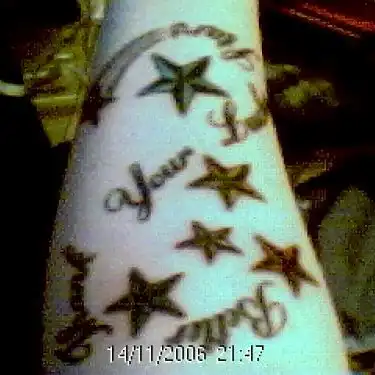 Stars with Cursive Script Tattoo