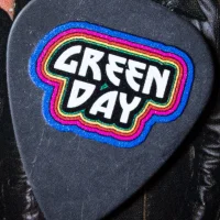 Hella Mega rainbow logo guitar pick