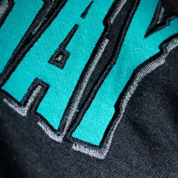 ¡Uno! ¡Dos! ¡Tré! era - grey and turquoise logo hoodie - close-up