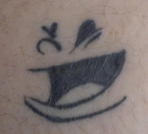 Face Logo Tattoo