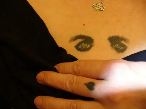Finger Heart with Stylized Eyes Tattoo