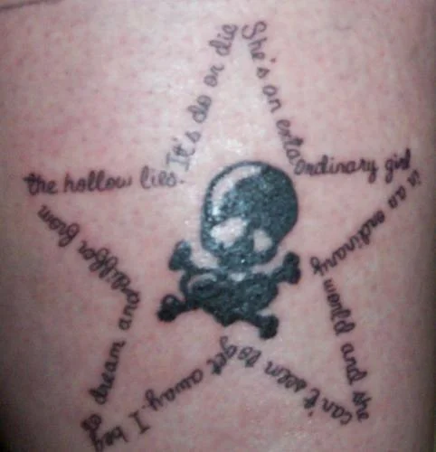 Extraordinary Girl Lyric Star with Skull Tattoo