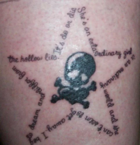 Extraordinary Girl Lyric Star with Skull Tattoo