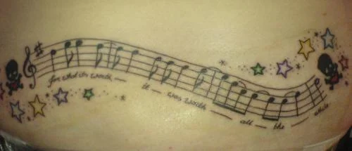 Musical Staff with Skulls and Stars Tattoo