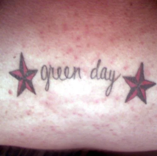 Green Day Logo with Red and Black Stars Tattoo