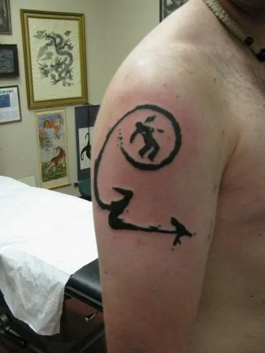 Warning Man Logo Tattoo