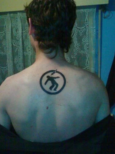 Warning Man Logo Tattoo