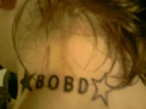 Text and Star Tattoo