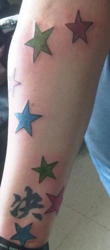 Multicolored Star with Calligraphic Characters Tattoo