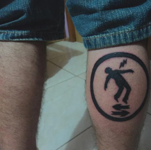Warning Man Logo Tattoo