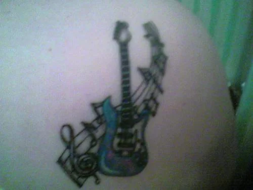 Blue Guitar and Music Notes Tattoo