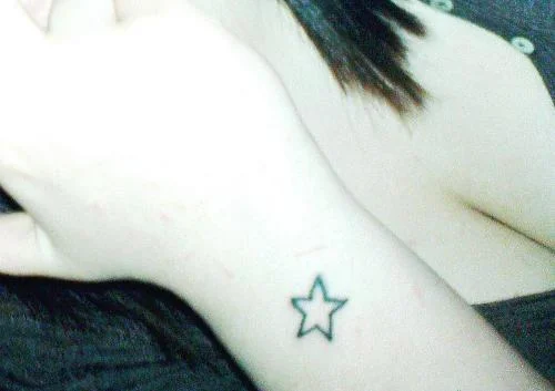 Small Outlined Star Tattoo