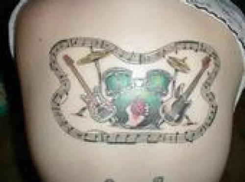 Green Drum Kit with Flanking Guitars Tattoo