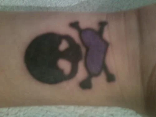 Heart-Eyed Skull Tattoo