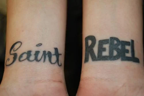 Saint and Rebel Text Tattoo