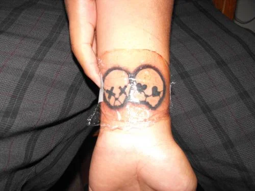 21st Century Breakdown Skull Faces Tattoo