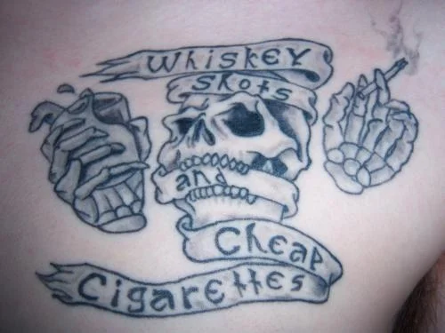 Skull with 'Whiskey Shots Cheap Cigarettes' Banner Tattoo