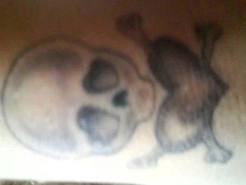 Skull and Heart-Shaped Design Tattoo