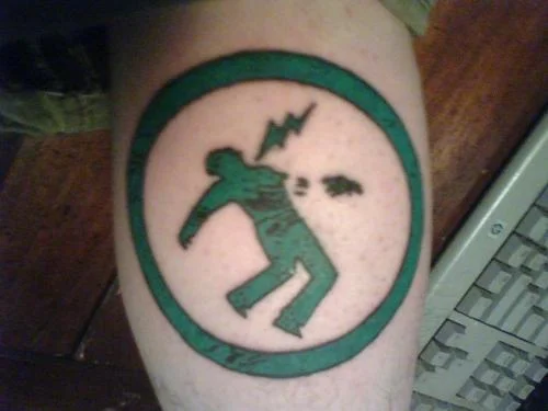 Warning Man Logo Tattoo