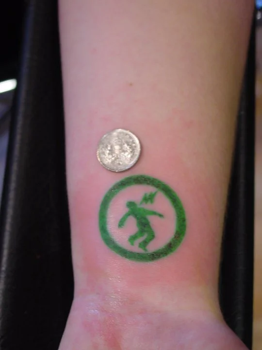 Warning Man Logo Tattoo