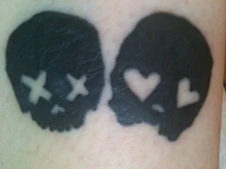 Skull with Heart Eyes Tattoo