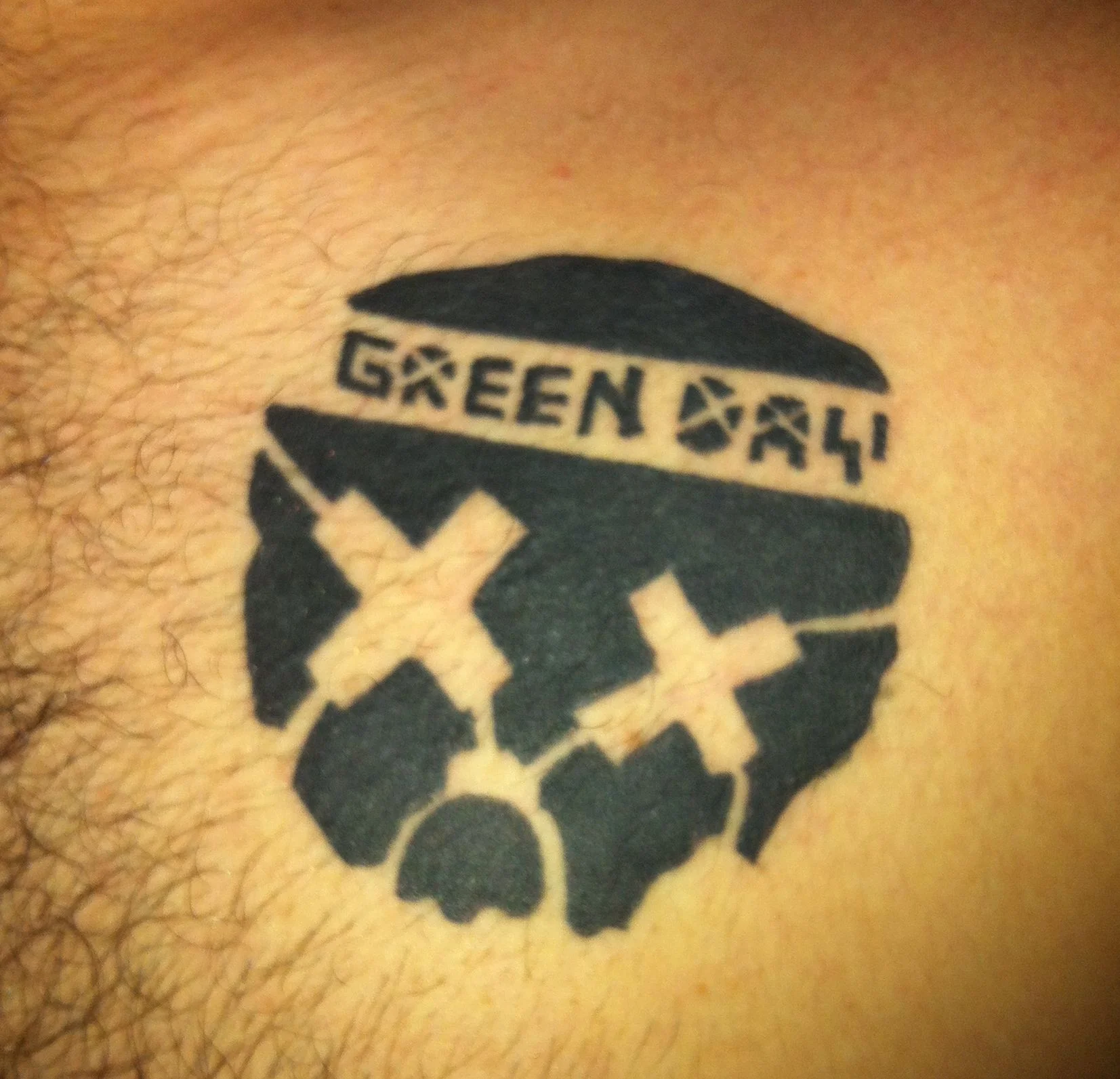 Green Day Skull and Crossbones Tattoo