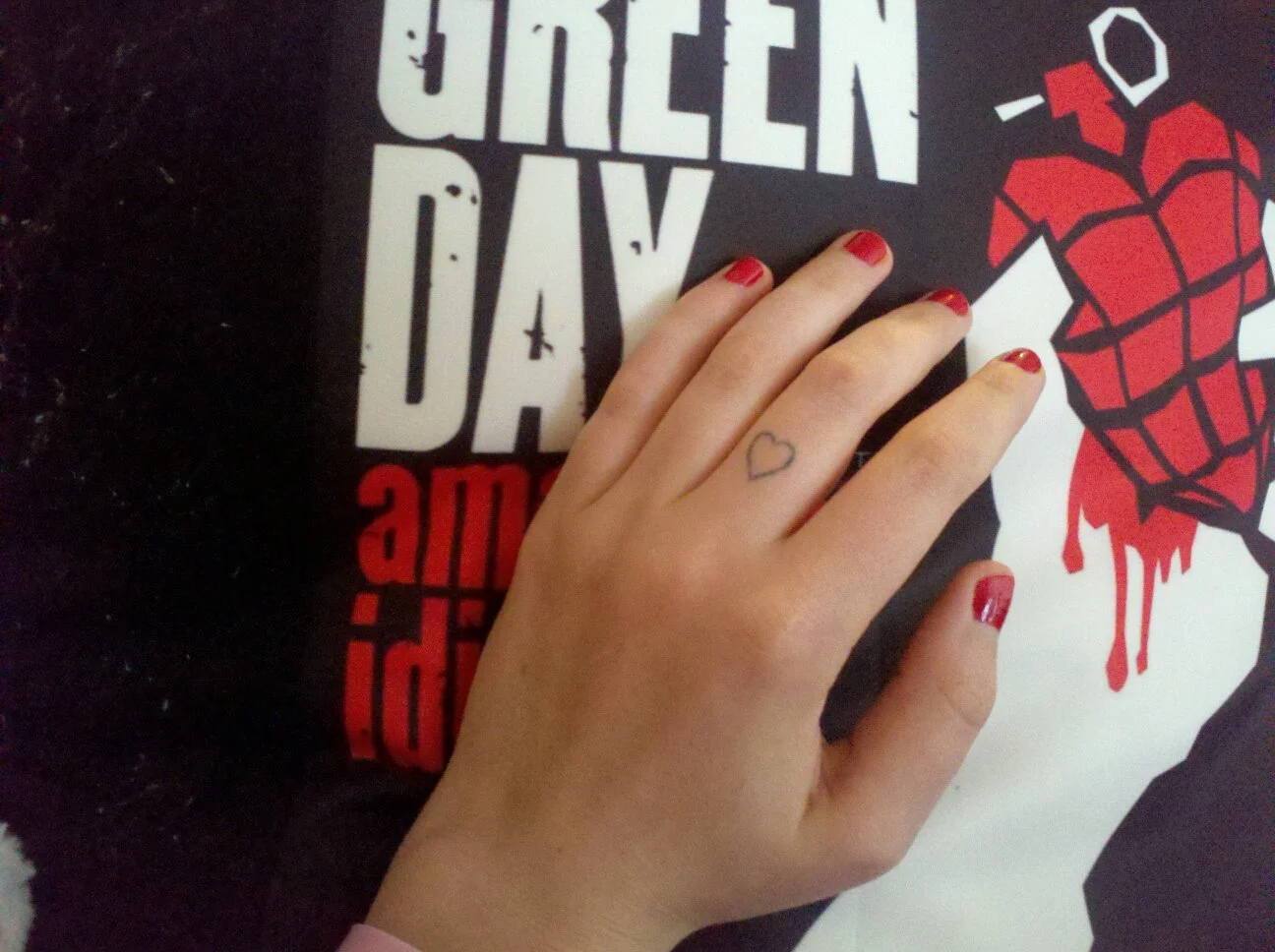 Heart on Finger Tattoo