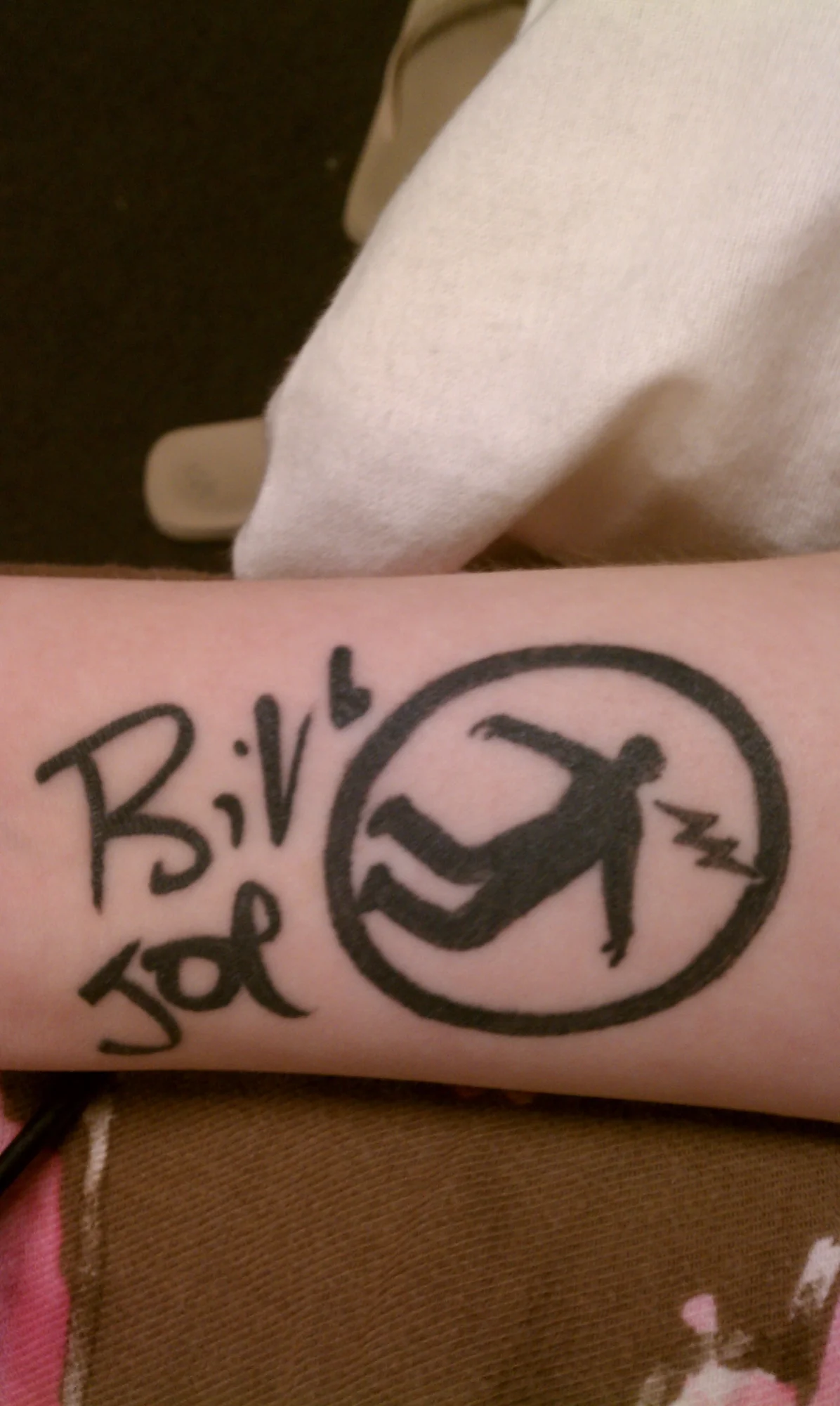 Warning Man Logo Tattoo